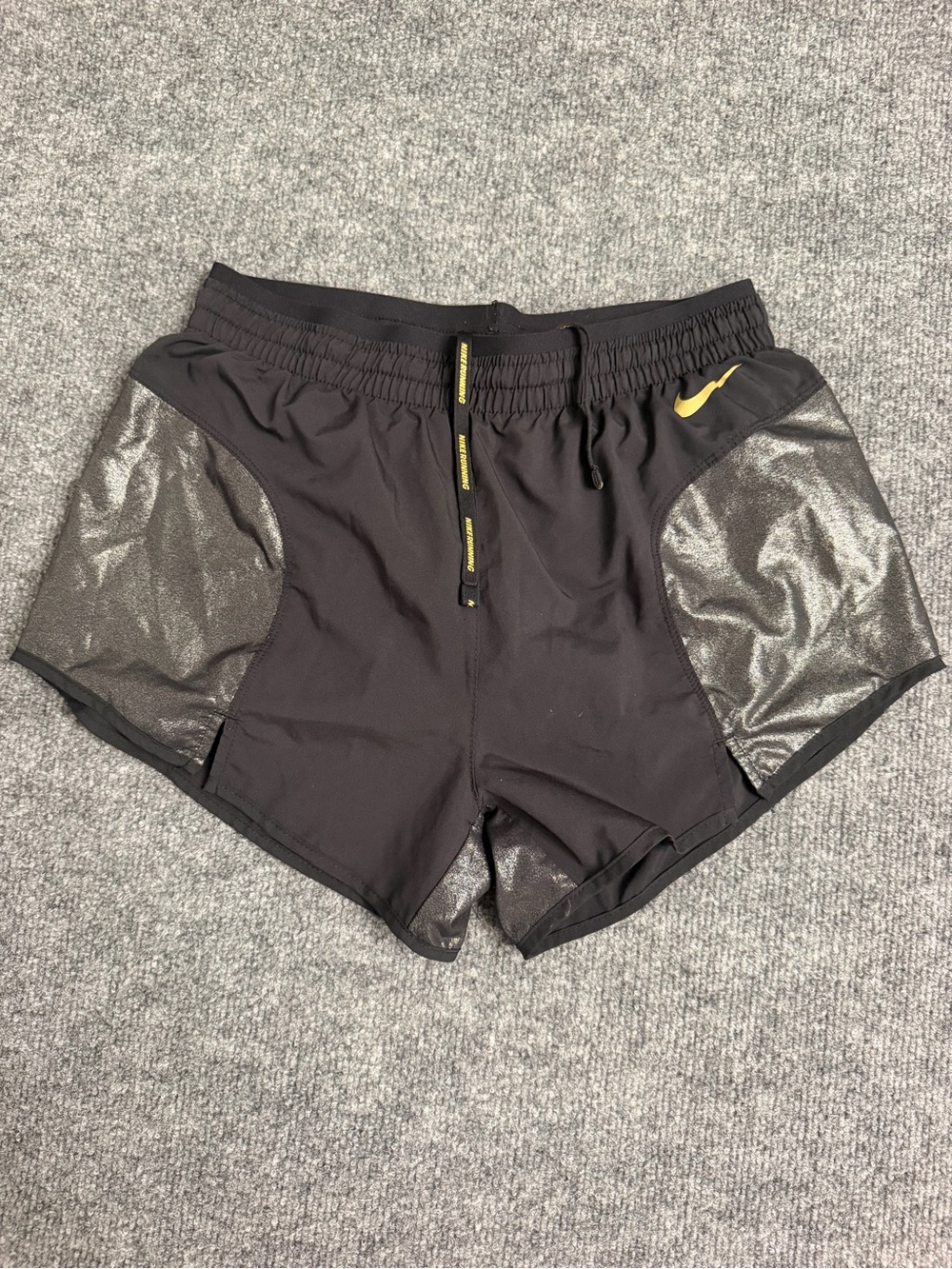 Nike Women’s Black Athletic Shorts with Yellow Swoosh